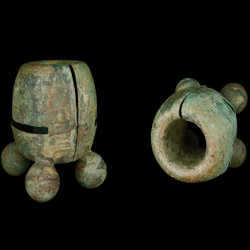 A pair of ancient Dong Son bronze ceremonial bracelets with bell projections from Vietnam